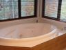 Spa with a corner window to mountain views
